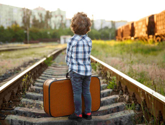 boy with suitcase standing on railways 2023 11 27 05 09 29 utc