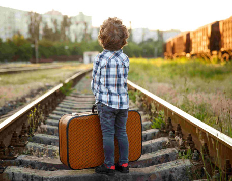 boy with suitcase standing on railways 2023 11 27 05 09 29 utc